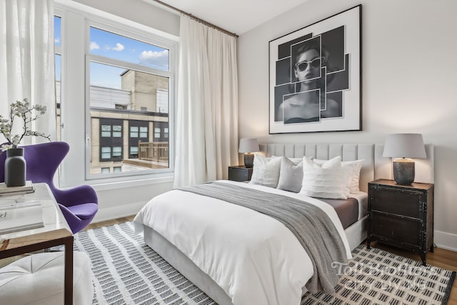 bedroom with hardwood / wood-style floors