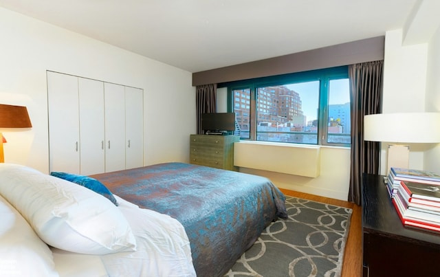 bedroom featuring a closet and hardwood / wood-style flooring