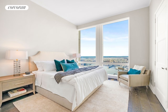 bedroom featuring visible vents and wood finished floors