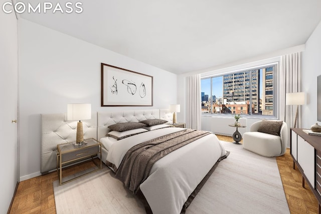 bedroom with light parquet floors