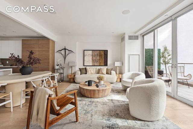 living room with light hardwood / wood-style flooring