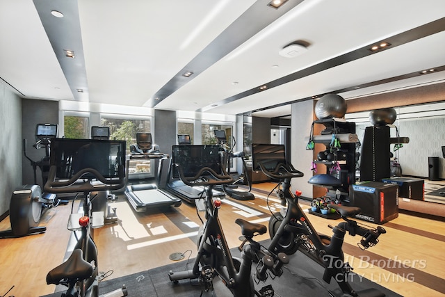 workout area with hardwood / wood-style flooring