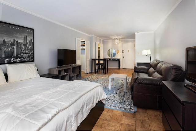 bedroom with crown molding and parquet flooring