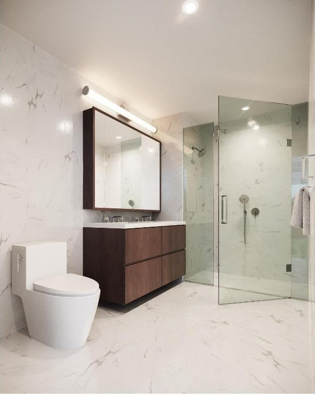 bathroom featuring vanity, an enclosed shower, and toilet