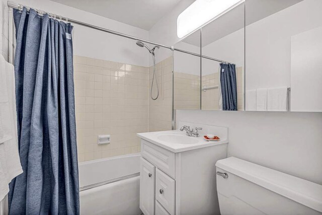 full bathroom with vanity, toilet, and shower / bath combo