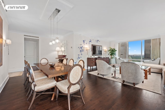 dining room with dark wood-type flooring and ornamental molding