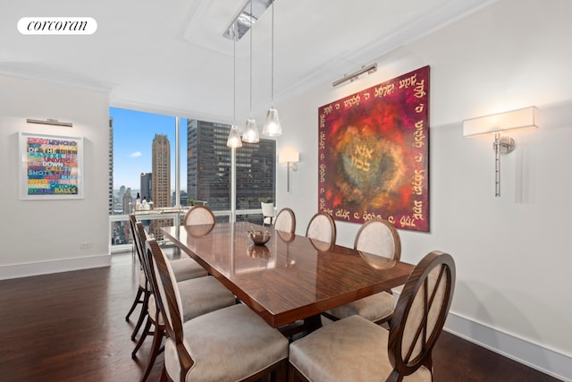 dining room with dark wood-type flooring, expansive windows, and ornamental molding