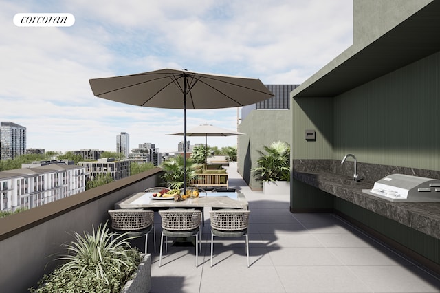 view of patio / terrace with visible vents, a city view, area for grilling, outdoor dining area, and an outdoor kitchen