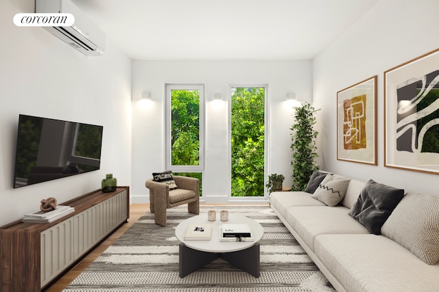 living area featuring wood finished floors and a wall mounted air conditioner