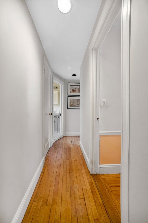 hallway featuring light wood-type flooring