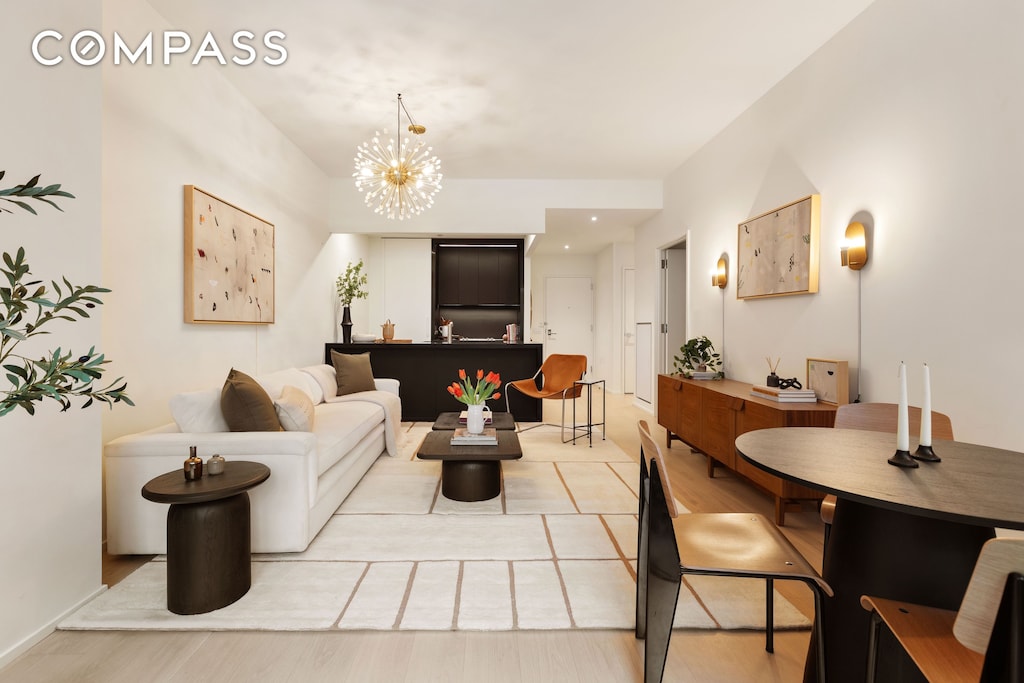 living room featuring a notable chandelier