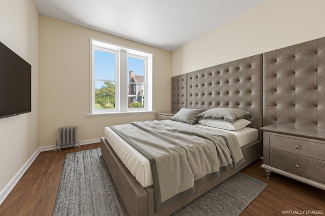 bedroom featuring dark wood-type flooring and radiator heating unit