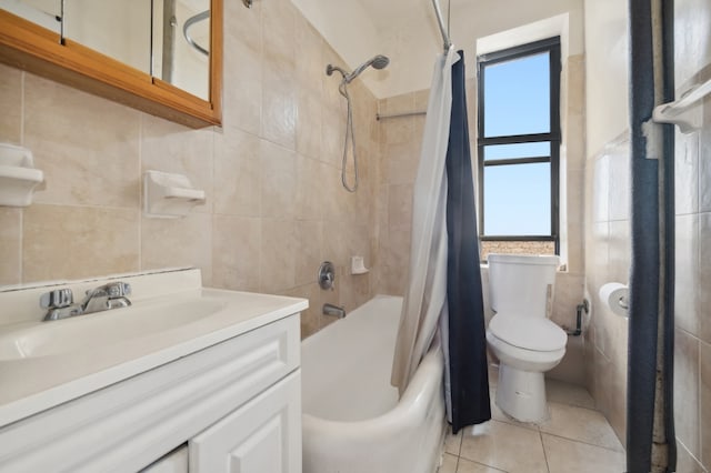 full bathroom featuring tile walls, tile patterned flooring, vanity, shower / bath combination with curtain, and toilet