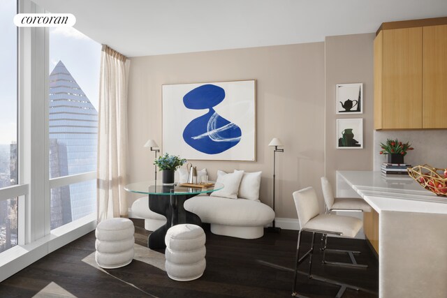 35 Hudson Yards Unit 7302, New York City, NY 10001 - dining space with dark wood-style flooring, healthy amount of natural light, and baseboards