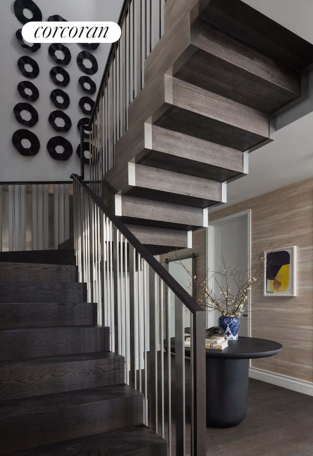 35 Hudson Yards Unit 7302, New York City, NY 10001 - stairway featuring baseboards and wood finished floors