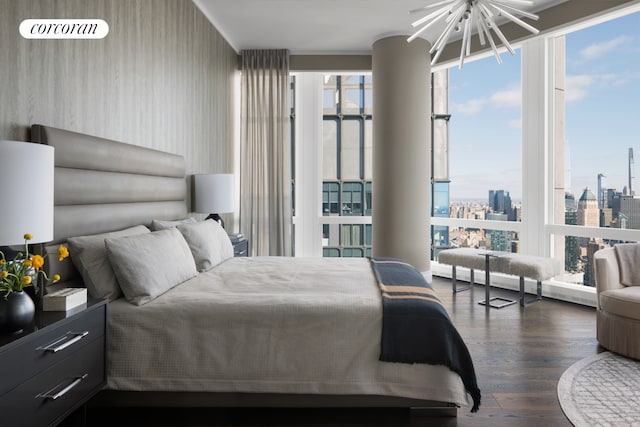 35 Hudson Yards Unit 7302, New York City, NY 10001 - bedroom with a chandelier, dark wood-type flooring, and multiple windows