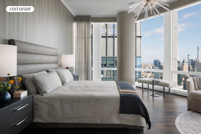 35 Hudson Yards Unit 7302, New York City, NY 10001 - bedroom featuring dark wood-type flooring, a chandelier, and multiple windows