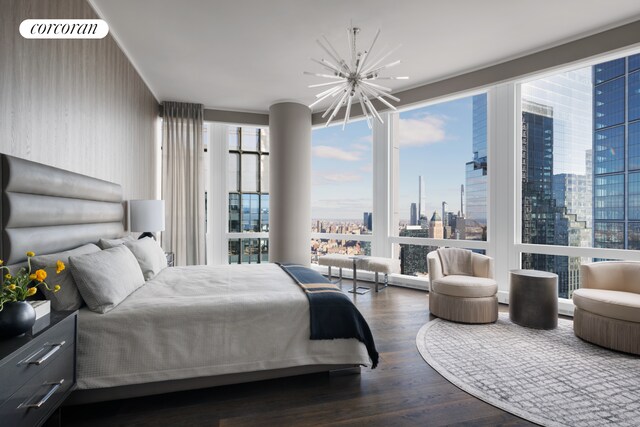 35 Hudson Yards Unit 7302, New York City, NY 10001 - bedroom with a chandelier, a city view, and wood finished floors