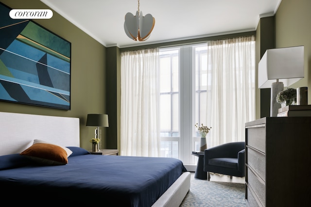 35 Hudson Yards Unit 7302, New York City, NY 10001 - bedroom featuring crown molding and a chandelier