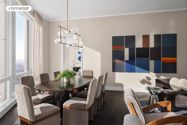 35 Hudson Yards Unit 7302, New York City, NY 10001 - dining space with healthy amount of natural light, ornamental molding, dark wood-type flooring, and baseboards
