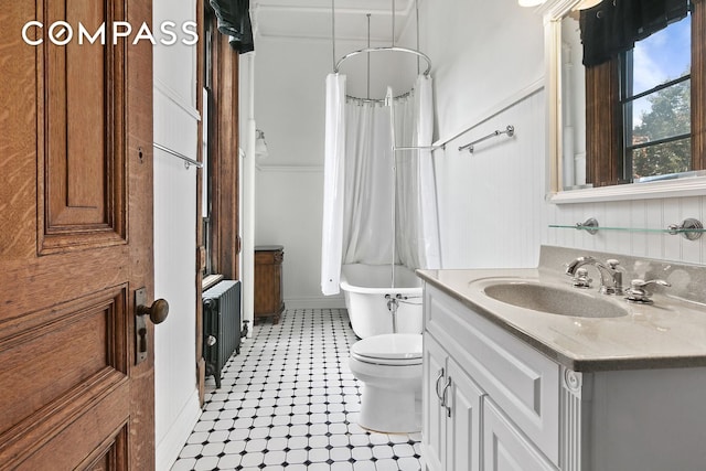 full bath with radiator, vanity, and toilet