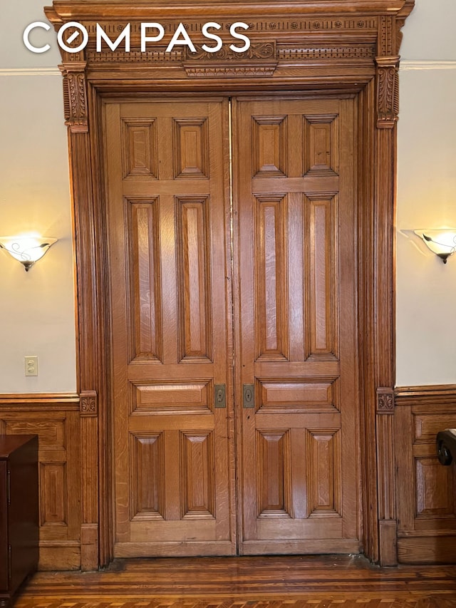 interior details with wainscoting and wood finished floors