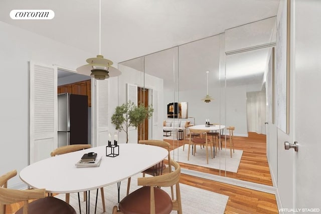 dining area with light wood-type flooring