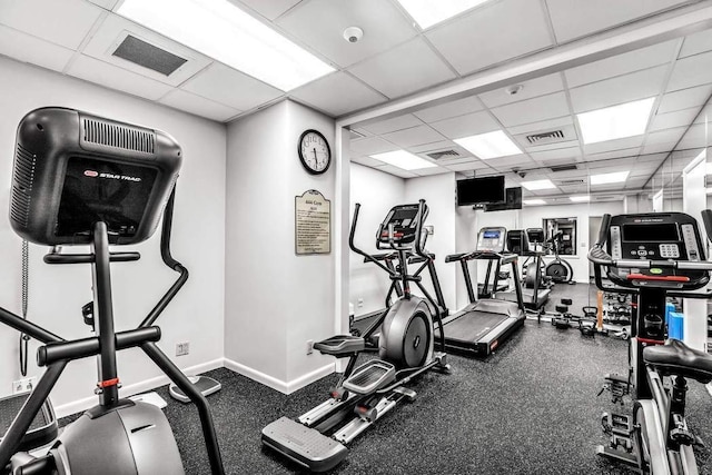 exercise room with a drop ceiling