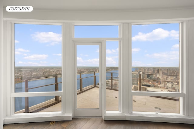 35 Hudson Yards Unit 8302, New York City, NY 10001 - unfurnished sunroom featuring a water view, wood finished floors, and ornamental molding