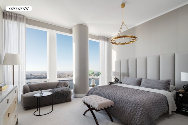 bedroom with multiple windows and carpet