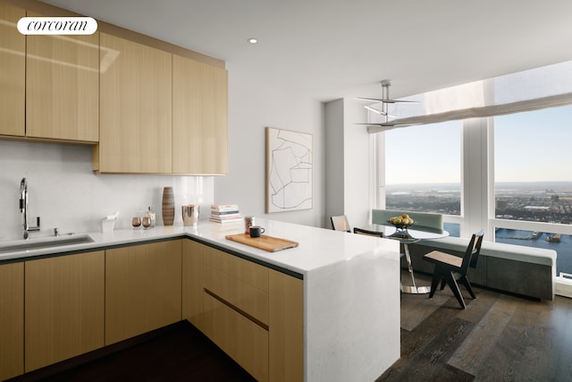 35 Hudson Yards Unit 8302, New York City, NY 10001 - kitchen featuring a sink, a peninsula, light brown cabinets, light countertops, and recessed lighting
