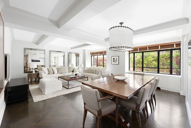 dining area featuring an inviting chandelier, beam ceiling, and dark parquet floors