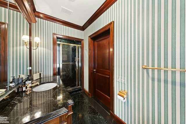 kitchen featuring a center island, appliances with stainless steel finishes, a kitchen breakfast bar, ornamental molding, and white cabinets