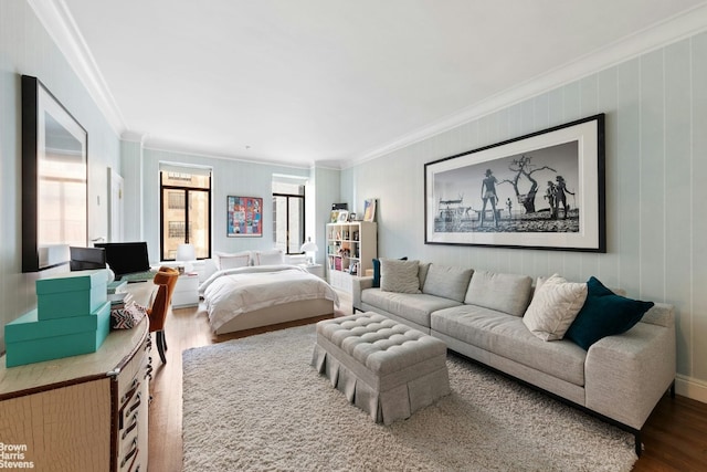 bedroom with hardwood / wood-style floors and crown molding