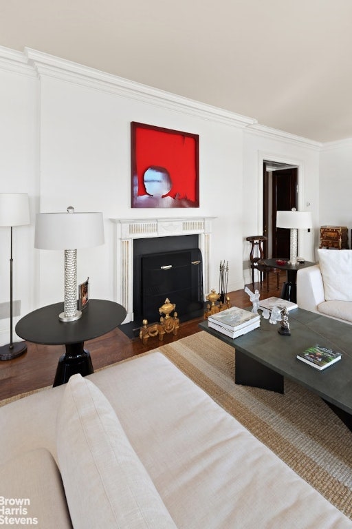 living room featuring crown molding