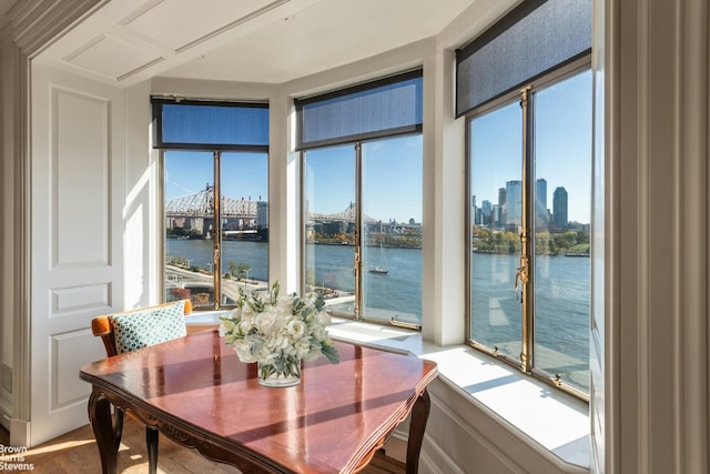 sunroom / solarium with a wealth of natural light and a water view