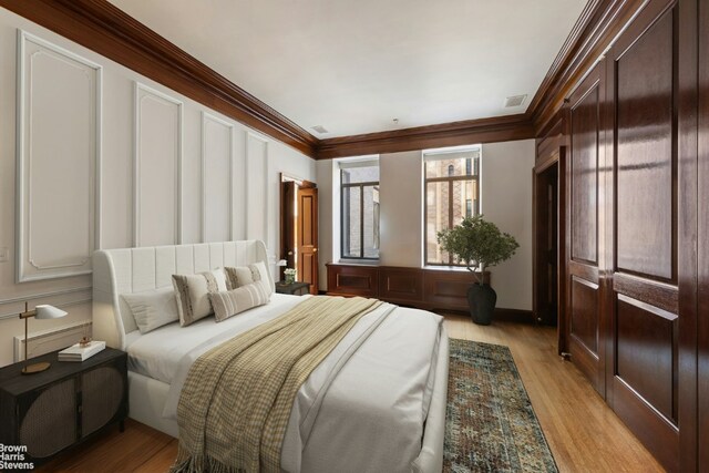 living room featuring a premium fireplace, ornamental molding, and dark hardwood / wood-style floors