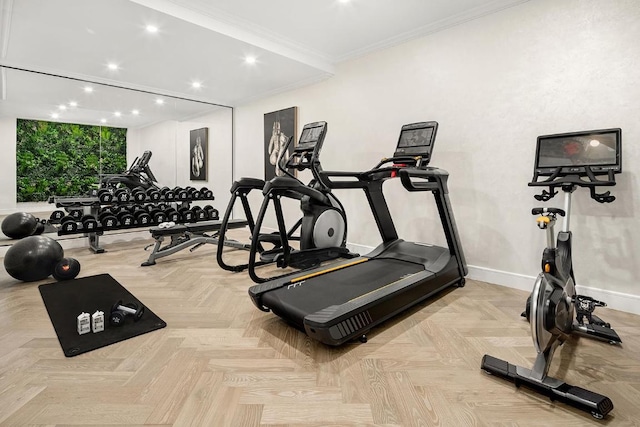 workout area featuring crown molding and light parquet flooring