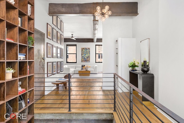 400 W 23rd St Unit 3Lk, New York City, NY 10011 - stairway with ceiling fan, beamed ceiling, and a chandelier
