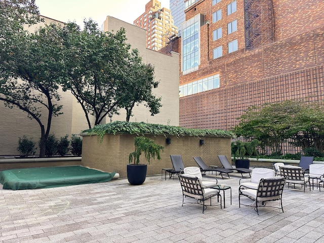 exterior space featuring a patio area and fence