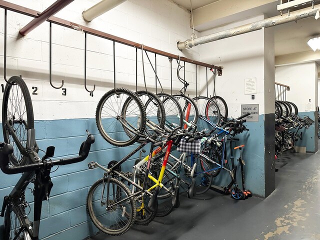 garage with concrete block wall and bike storage