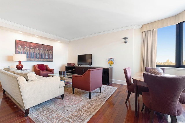 living area with ornamental molding, dark wood-type flooring, and baseboards