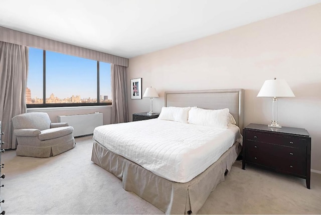 carpeted bedroom featuring radiator heating unit