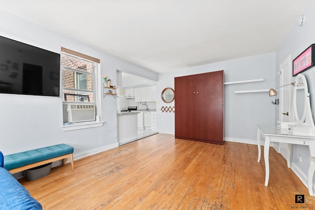 entryway featuring light wood-type flooring and baseboards