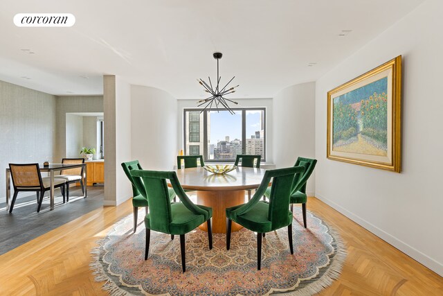 425 E 58th St Unit 36Ab, New York City, NY 10022 - dining room with visible vents, a notable chandelier, wallpapered walls, and baseboards