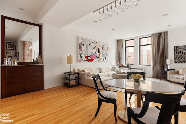 dining space with light hardwood / wood-style floors