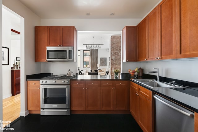 kitchen with appliances with stainless steel finishes and sink