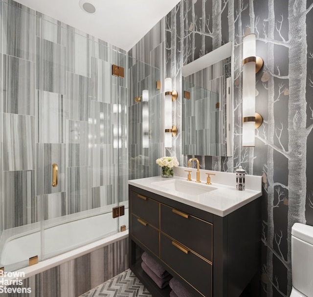 full bathroom featuring vanity, tile walls, a shower stall, and toilet