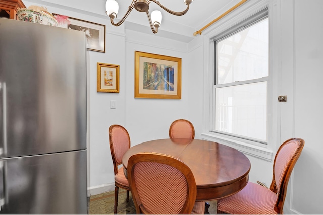 155 E 49th St Unit 9F, New York City, NY 10017 - dining space featuring a chandelier