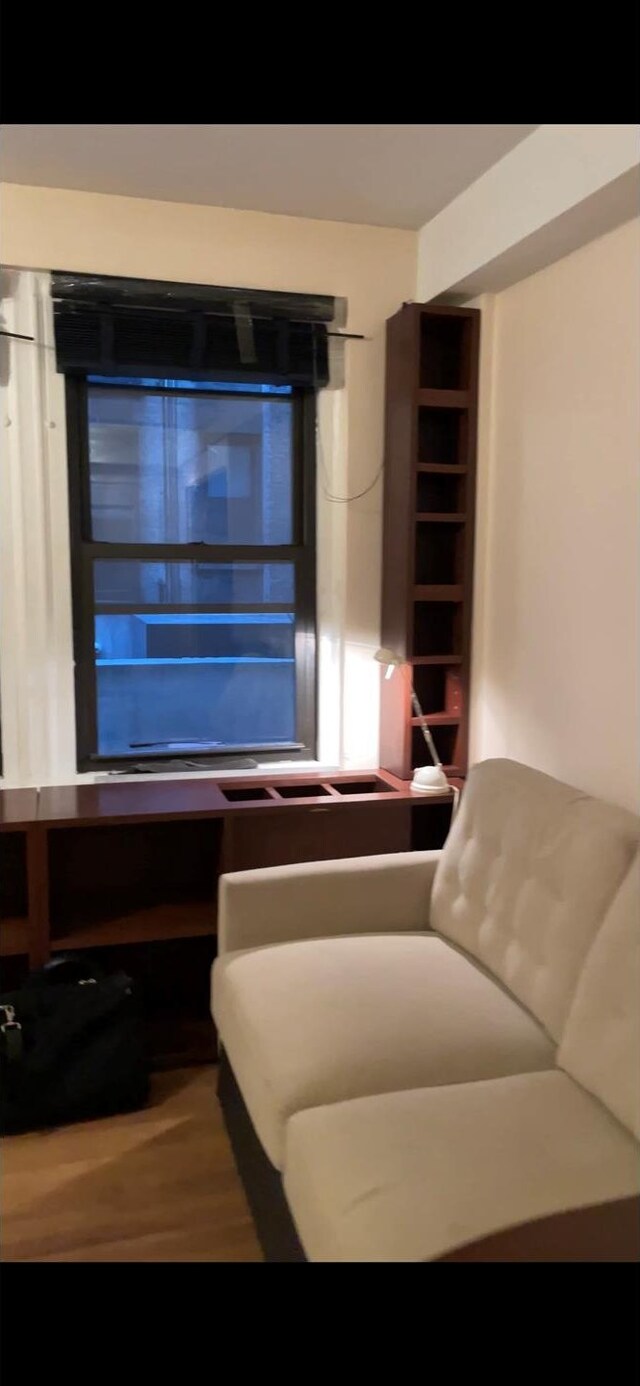 155 E 49th St Unit 9F, New York City, NY 10017 - sitting room featuring wood finished floors